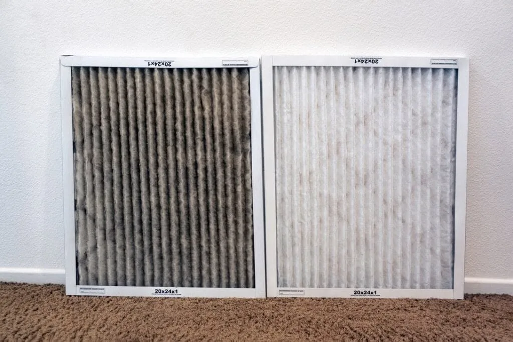 Dirty and clean furnace filter comparison from a Great Lakes Comfort tune-up in Howell, MI