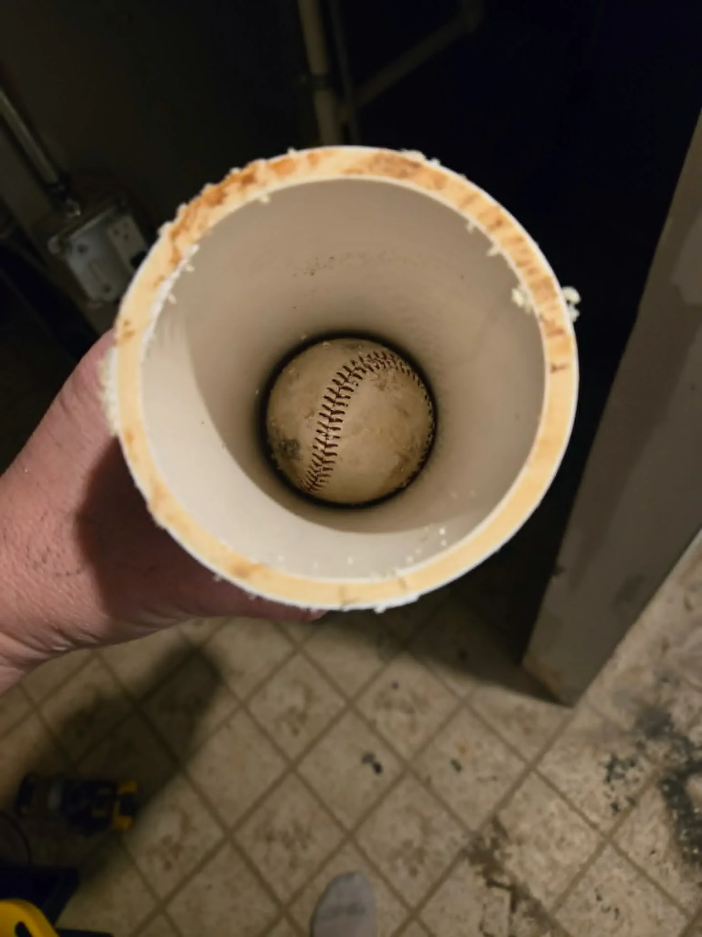 Baseball stuck inside a furnace flue pipe found during a Great Lakes Comfort service call in Howell, MI