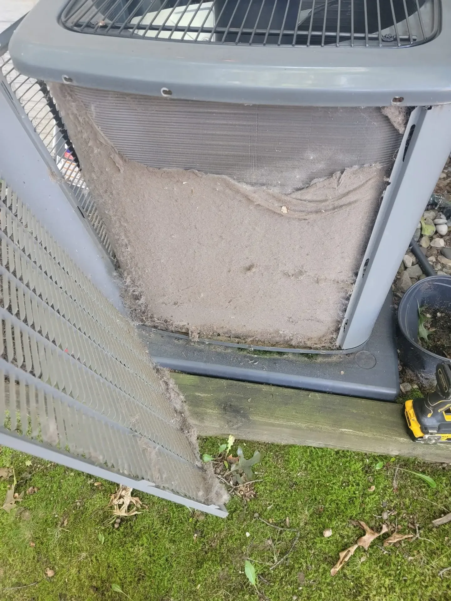 Extremely clogged AC condenser unit found on a Great Lakes Comfort tune-up in Howell, MI