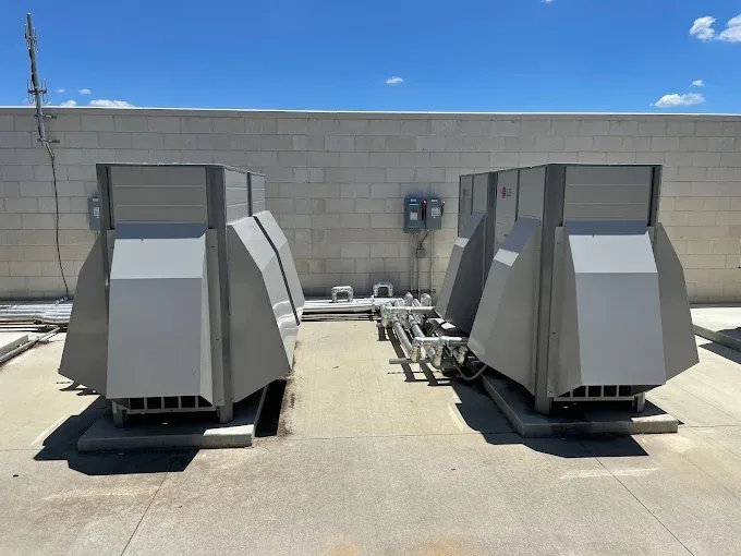 Two commercial rooftop AC units serviced by Great Lakes Comfort in Howell, MI