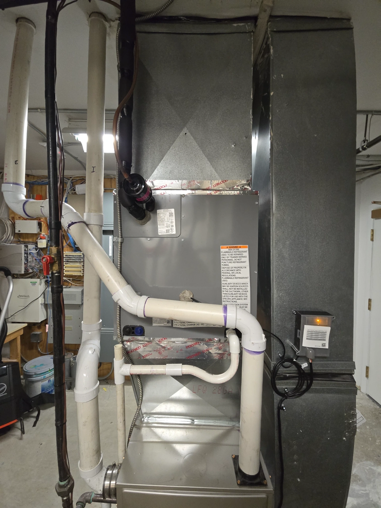 New furnace unit with ductwork installed by Great Lakes Comfort in Howell, MI