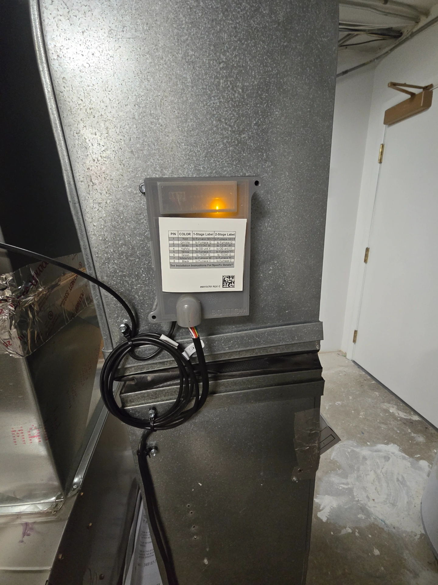 Great Lakes Comfort technician diagnosing a furnace control board in Howell, MI