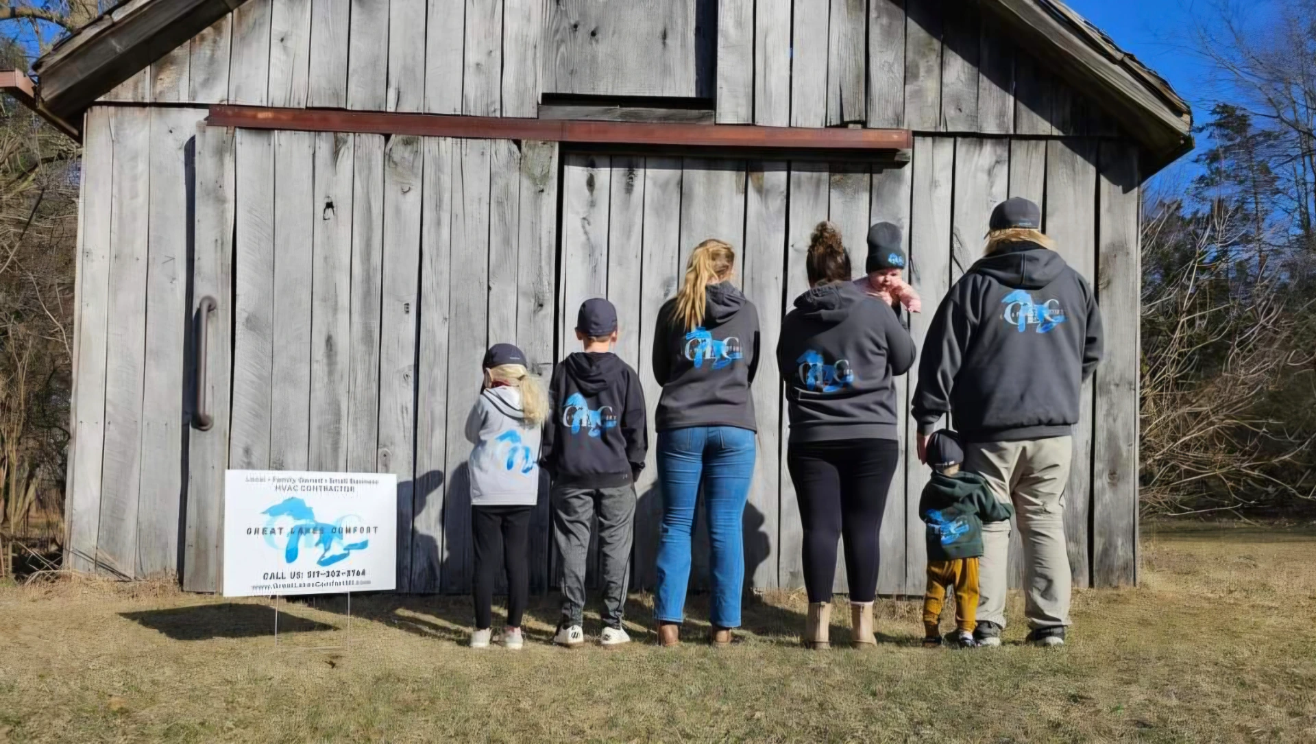 Great Lakes Comfort family in front of the Howell MI shop